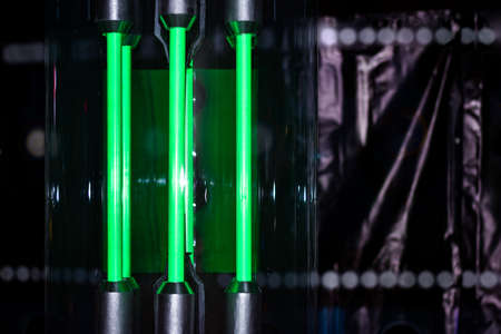 Green glowing neon lamps in  labの写真素材
