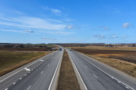 Highway with freight tracks in early spring in Europe.の写真素材