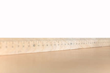 Wooden ruler on the table and whiteの写真素材