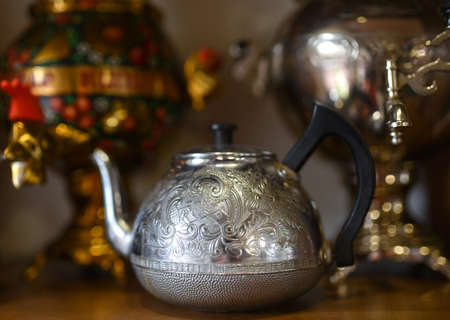 Old Russian samovar stands on a shelf.の写真素材
