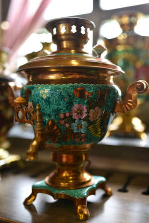 Old Russian samovar stands at the window.