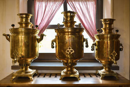 Old Russian samovar stands at the windowの写真素材