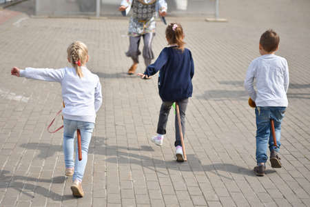 Children playing catch-up in the city.の写真素材