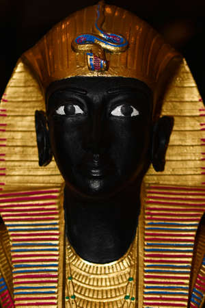 The old head of the Egyptian sculpture of the pharaoh.
