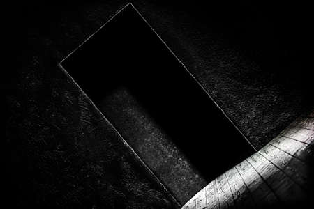 Light from the door on a black background, mystic.の写真素材