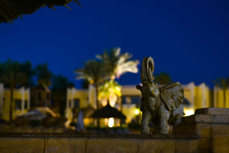 Bright lights at the tropical hotel at night.の写真素材