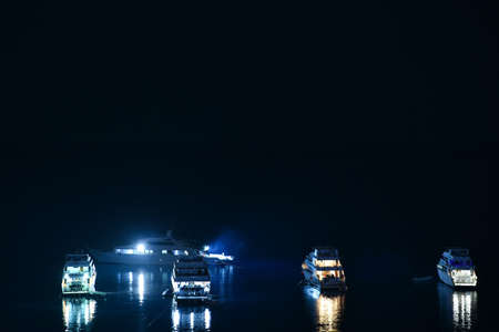 Diver yachts at sea at night.の写真素材