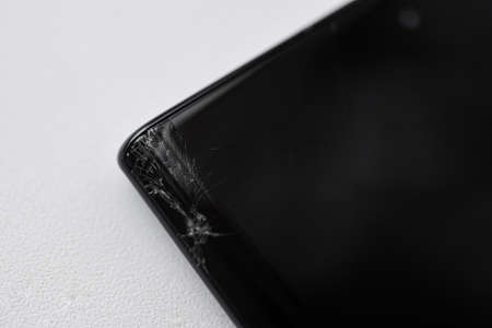 Broken corner of a smartphone curved screen.の写真素材