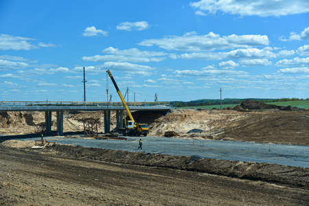 A new bridge is being built during the construction of the road.の写真素材