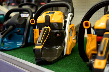 Chainsaws stand in a shop market.