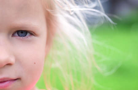 Portrait of a romantic blonde child girl with her hair.の写真素材