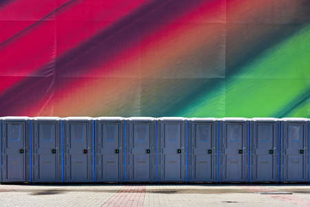 A long row of public toilets on a street party.の写真素材