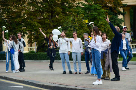 Editorial photo People with white bracelets and flowers at a protest against Lukashenka government...