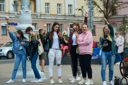 Editorial photo People with white bracelets and flowers at a protest against Lukashenka government in Belarus, Minsk, 08/13/2020.のeditorial素材