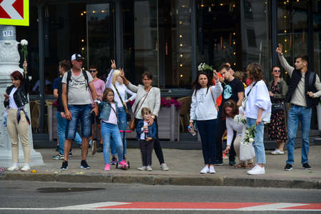 Editorial photo People with white bracelets and flowers at a protest against Lukashenka government...