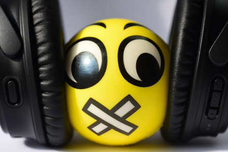 Suppression of free speech, smiley, hatred, nayshniki, leg, hand, stapler.の写真素材