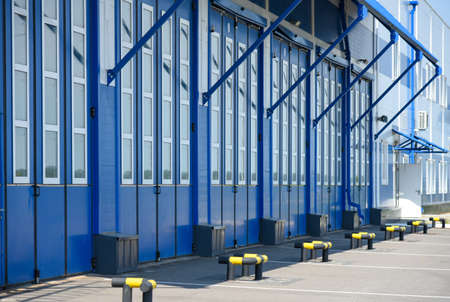 Blue gate of the garage box of the fire station.