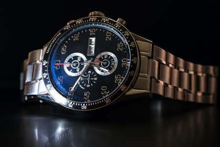 Luxury quartz chronograph watch on a black background, close-up.の写真素材