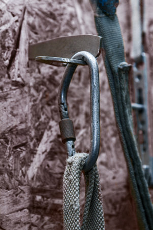 Old climbing carbine on the rock, close up.の写真素材