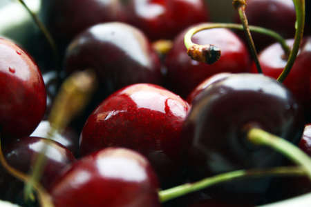 A plate of sweet ruby cherry macroの写真素材