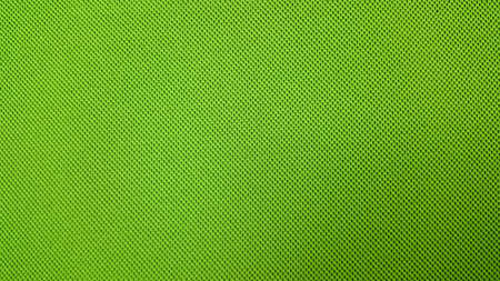 Green background textile material with pattern, closeup.の写真素材