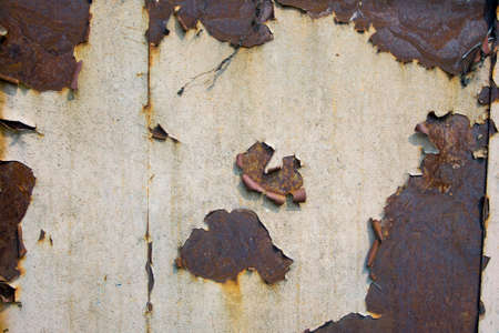 Rusty metal plate peeling paint texture surfaceの写真素材