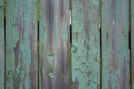 Old wooden fence shabby turquoise paint textureの写真素材