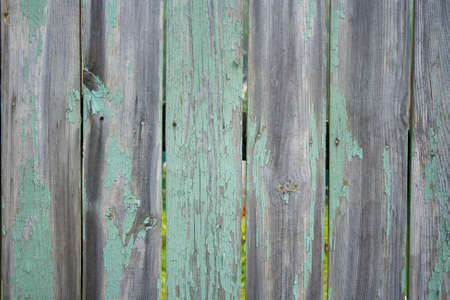 Old wooden fence shabby turquoise paint textureの写真素材