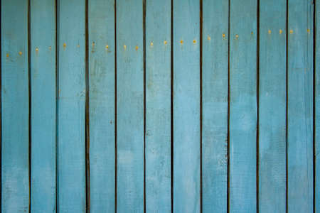 Old wooden fence shabby turquoise paint textureの写真素材