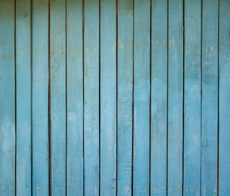 Old wooden fence shabby turquoise paint textureの写真素材