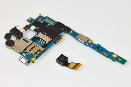 Disassembled in the service center mobile phone. Smartphone chip and camera