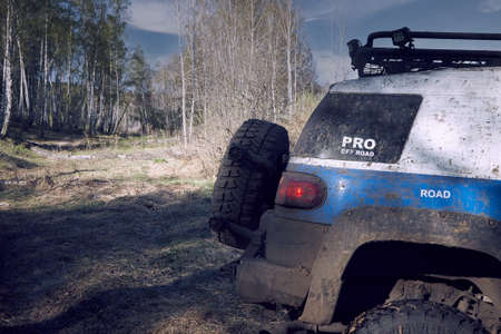 Travel off-road on a mountain road in a 4x4 car. Beautiful nature sunset