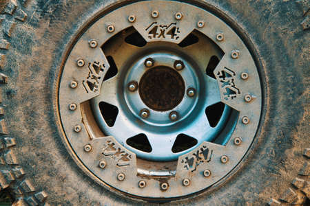 Close-up of a tire with a disc on a 4x4 four-wheel drive car. Wheel of an off-road car splattered with mud. The concept of adventure, travel or rally sportsの写真素材