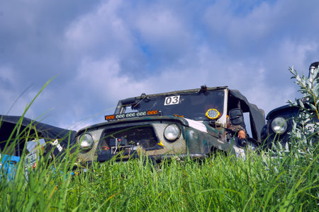 General view of 4x4 off-road vehicles built on a hill before the start of extreme competitions. Cross-country racingの写真素材