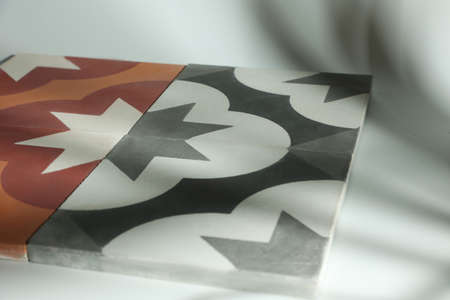 Samples interior materials contain gray and brown concrete tiles with pattern in form an...