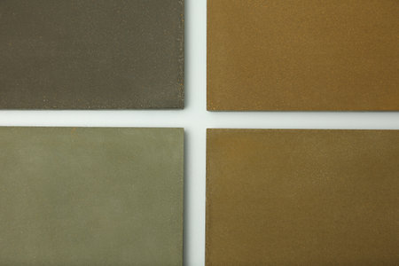 Close-up view from above the joints of modern concrete paving slabs. Demonstration of different...