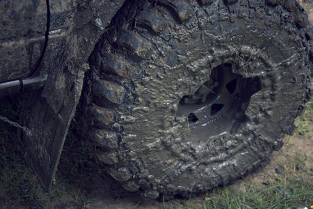 Traveling through impassable terrain.Very dirty off road wheel is on the road. Four wheel drive car...