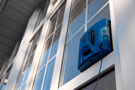 Square-shaped robot for washing windows. High-quality glass cleaning with the help of modern technologyの写真素材