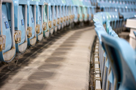 Stepped space between rows of seats. Distance between the rows of seats with enough space to make it convenient and easy for spectators to pass between the rows even with a large crowd of people.の写真素材