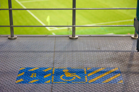 Special fenced area in the football stadium to accommodate fans with disabilities. Wheelchair...