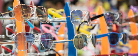 The stand with childrens sunglasses in the kids shopの写真素材