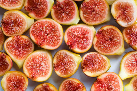 Background filled with fresh sliced figs. Close-upの写真素材