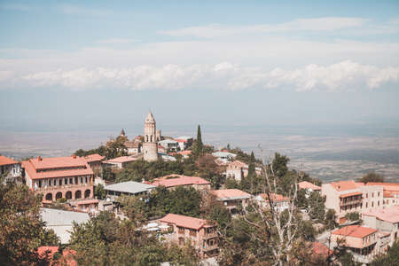 Picturesque view of the city in mountains in asia. Vibrant travel picture. Roofs of housesの写真素材
