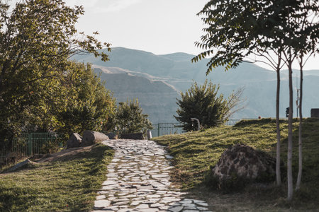 Path in the park with mountain view in town in Armenia. Scenic mountain view on the sunrise. Tourism in Armenia. High quality photoの写真素材