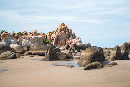 Scenic view of large beige-yellow stones among grass and trees. beauty of natureの写真素材