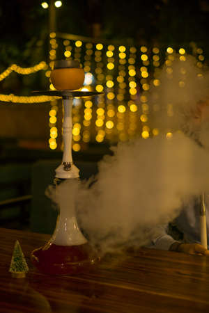 Fruit Hookah stands on the table. Grapefruit hookah. For restaurant menu. high quality photo