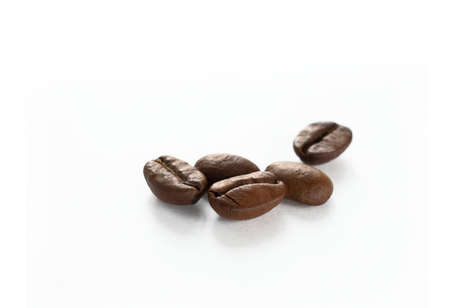 roasted coffee beans on a white backgroundの写真素材