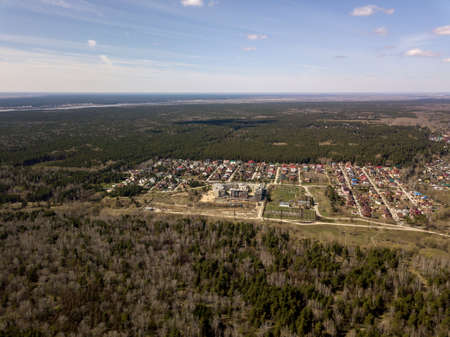 Clouds in the blue sky wih forest under them at Novosibirsk, Russia. Forest and skyline.の写真素材