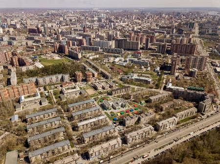 Old and new russian buildings in green area in the cty with a lot of cars. Zhukovskogo street, Novosibirsk.の写真素材