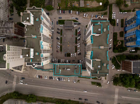 Aerial View of n-shaped skyscraper with parking cars in the city. Dachnaya street, Novosibirsk.の写真素材